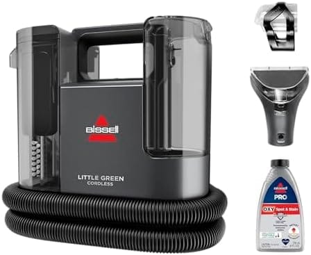 Bissell Little Green Cordless 3682 battery-powered carpet cleaner detailing a car seat in a driveway